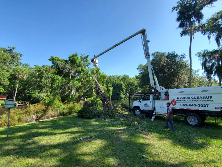 ACI storm cleanup truck and bucket crew on site
